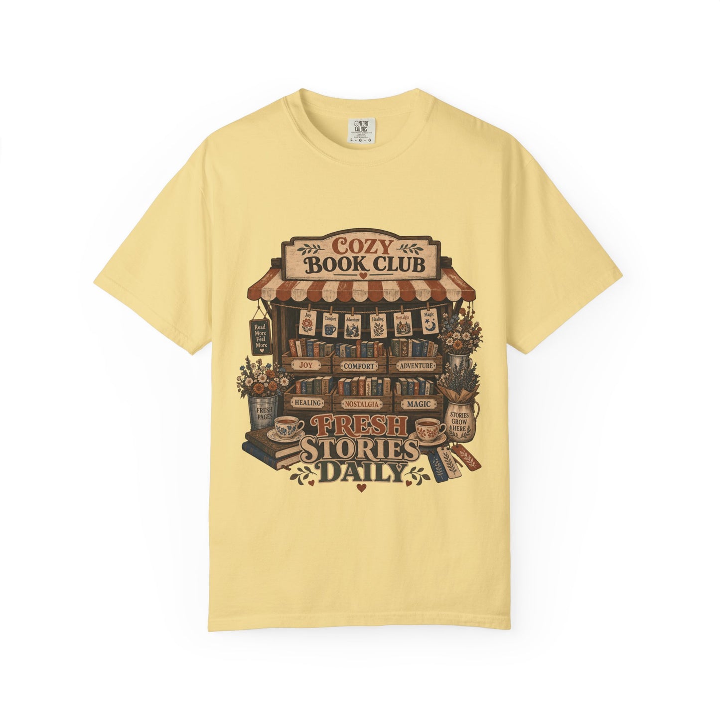Fresh Stories Daily book club T-shirt in Butter featuring a vintage bookstall filled with books, flowers and reading themes