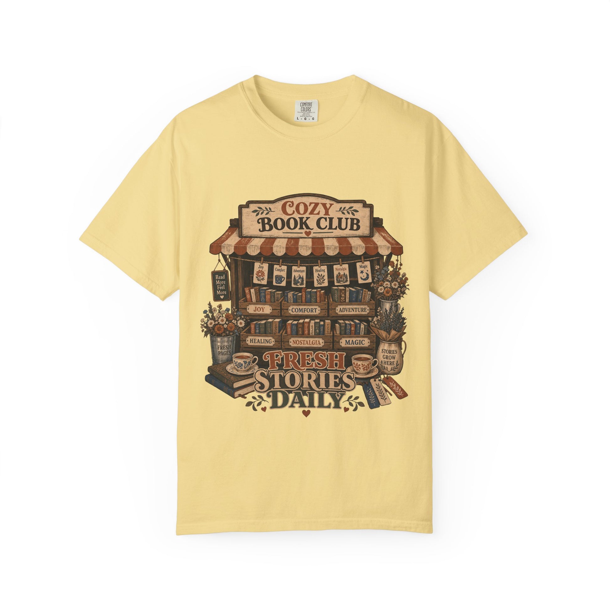 Fresh Stories Daily book club T-shirt in Butter featuring a vintage bookstall filled with books, flowers and reading themes