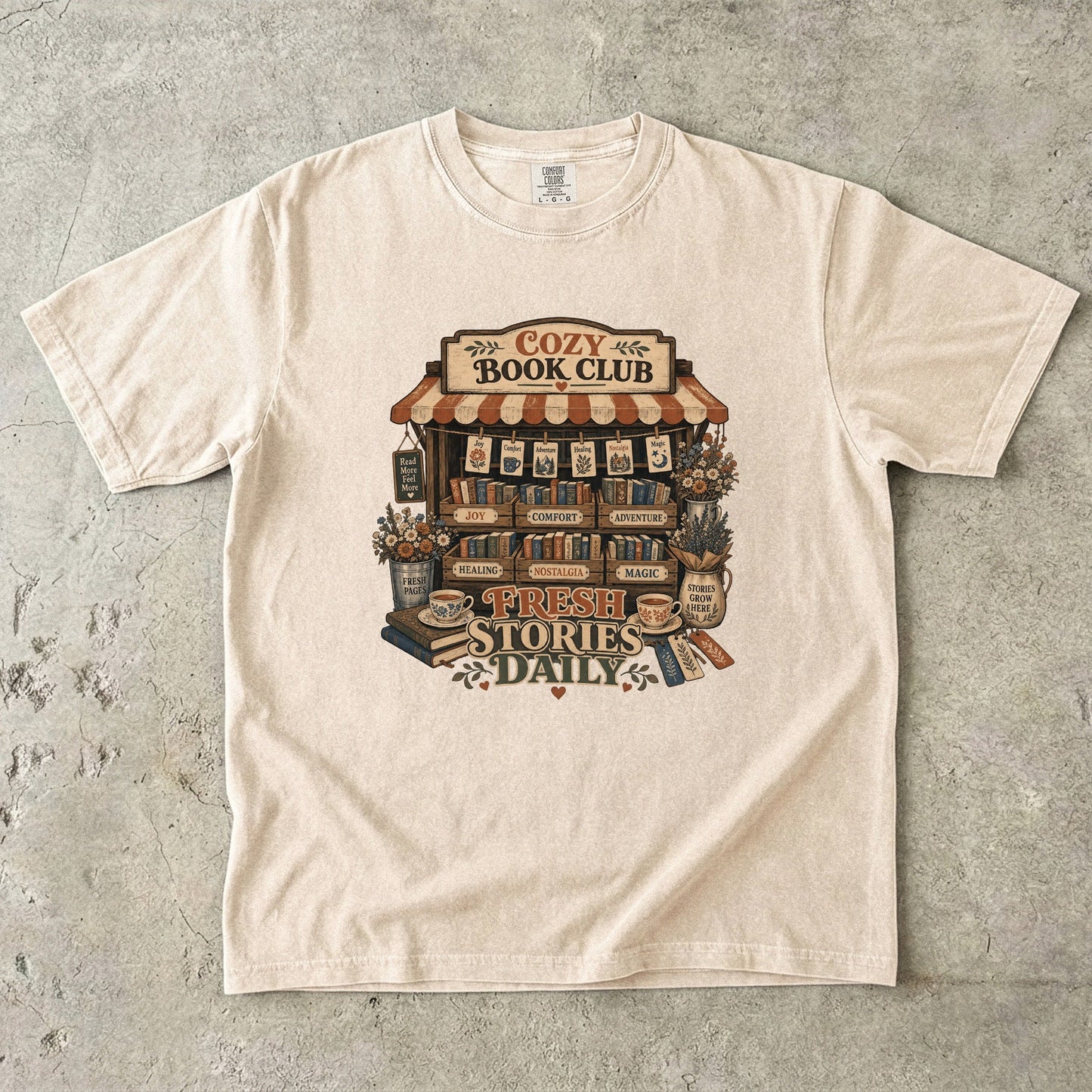 Fresh Stories Daily book club T-shirt in Ivory featuring a vintage bookstall filled with books, flowers and reading themes