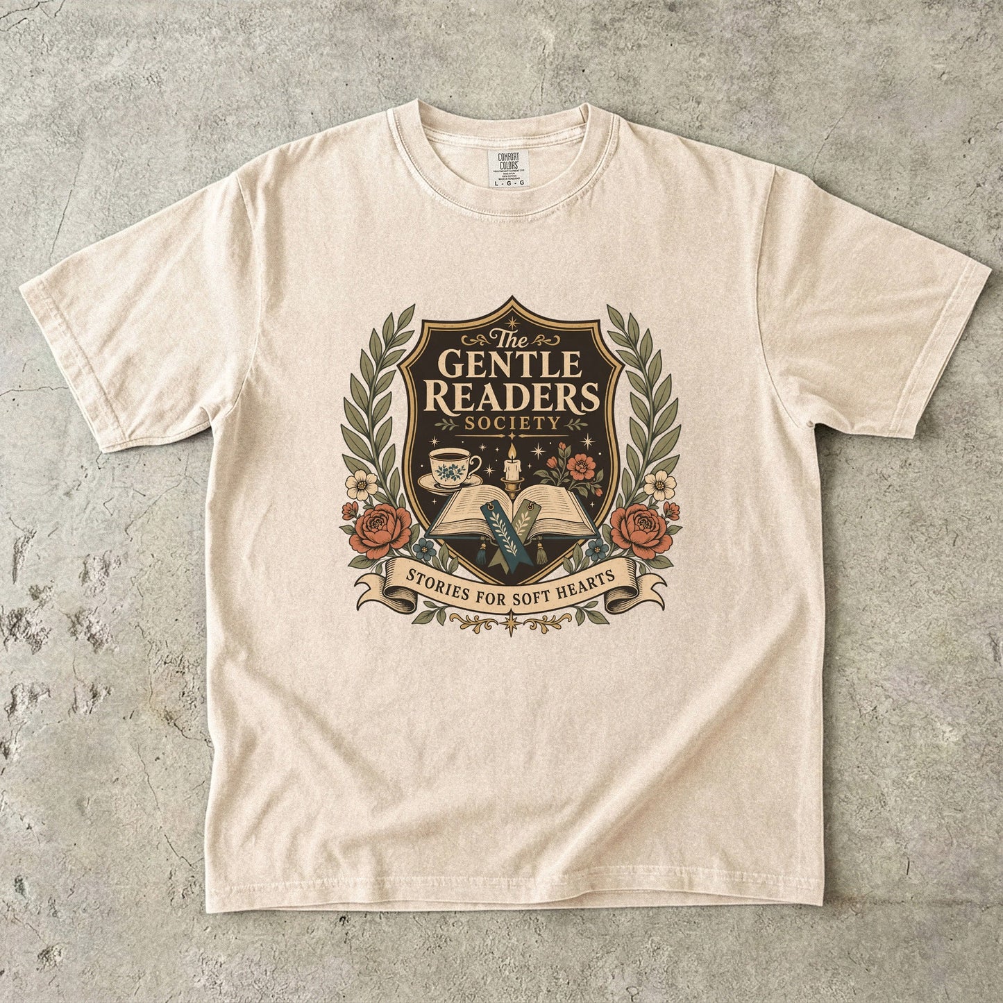 The Gentle Readers Society book club T-shirt with open book, tea and floral crest on Ivory.