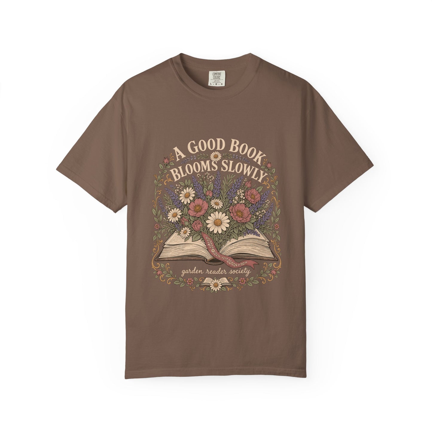 A Good Book Blooms Slowly botanical reading T-shirt with an open book and flowers on Espresso.