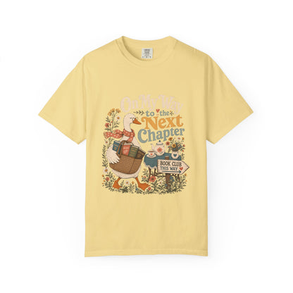 On My Way to the Next Chapter book club T-shirt with goose carrying a basket of books on Butter.