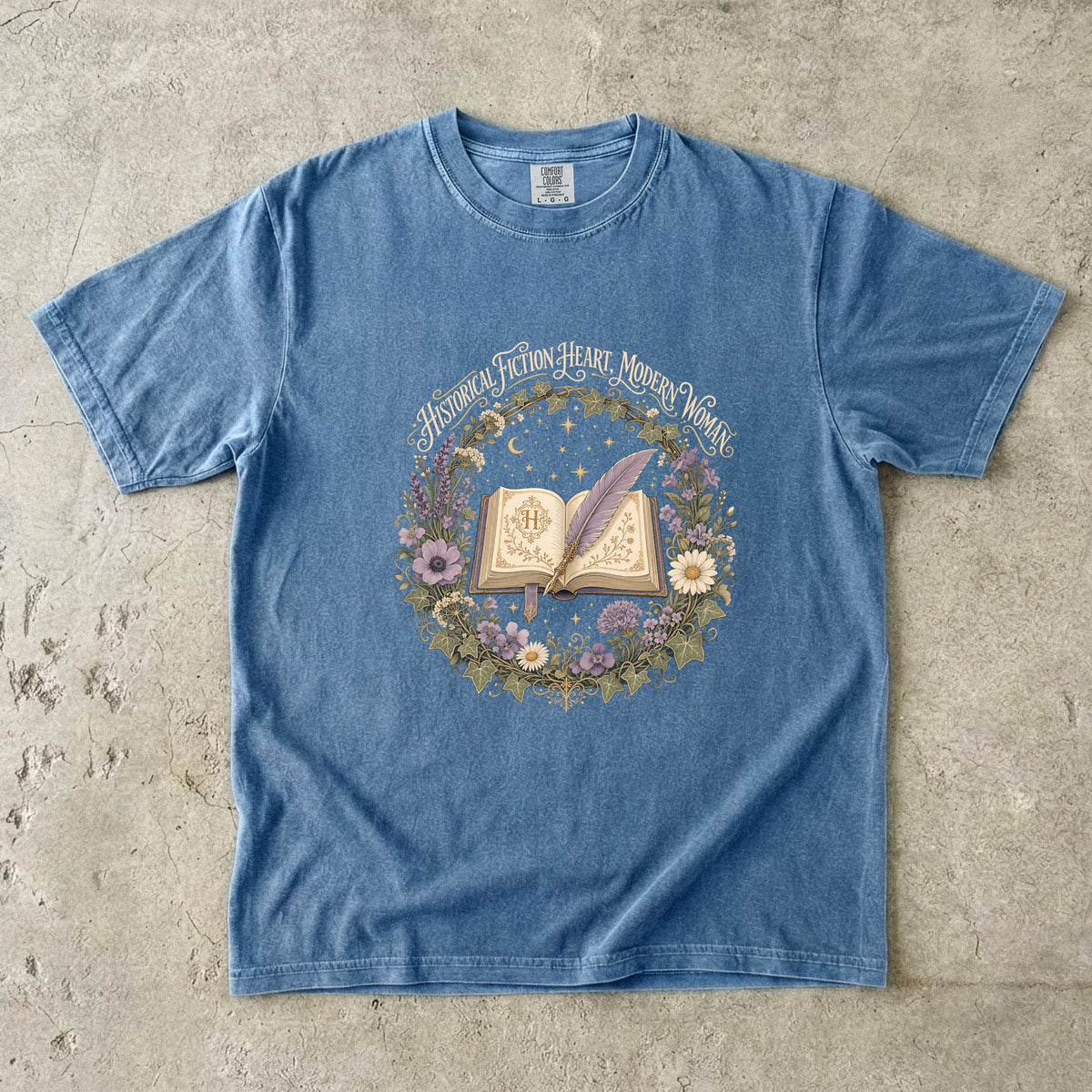 Blue Jean historical fiction T-shirt featuring Historical Fiction Heart, Modern Woman with an open book, lavender quill, moon and wildflowers.