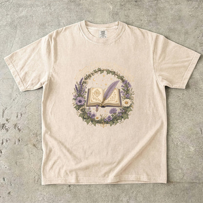 Ivory historical fiction T-shirt featuring Historical Fiction Heart, Modern Woman with an open book, lavender quill, moon and wildflowers.