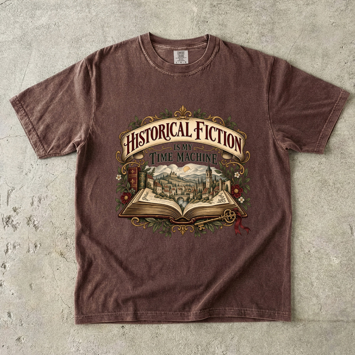 Espresso T-shirt featuring “Historical Fiction Is My Time Machine” with an open book revealing an old-world town, ornate gold framing, antique books, leaves and burgundy flowers.