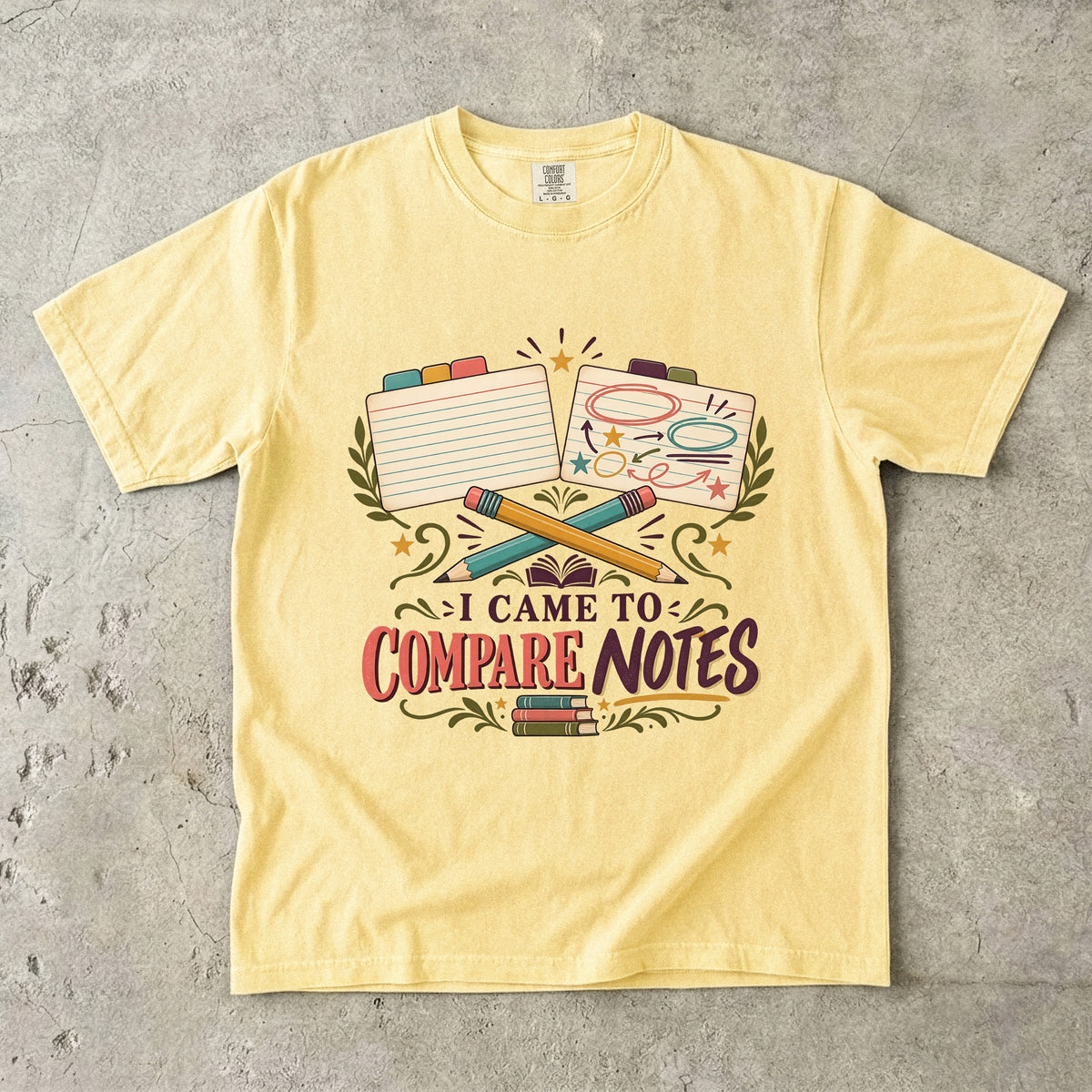Butter book club T-shirt with “I Came to Compare Notes,” tabbed note cards and crossed pencils