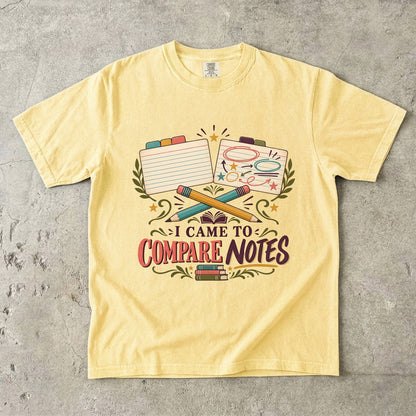 Butter book club T-shirt with “I Came to Compare Notes,” tabbed note cards and crossed pencils