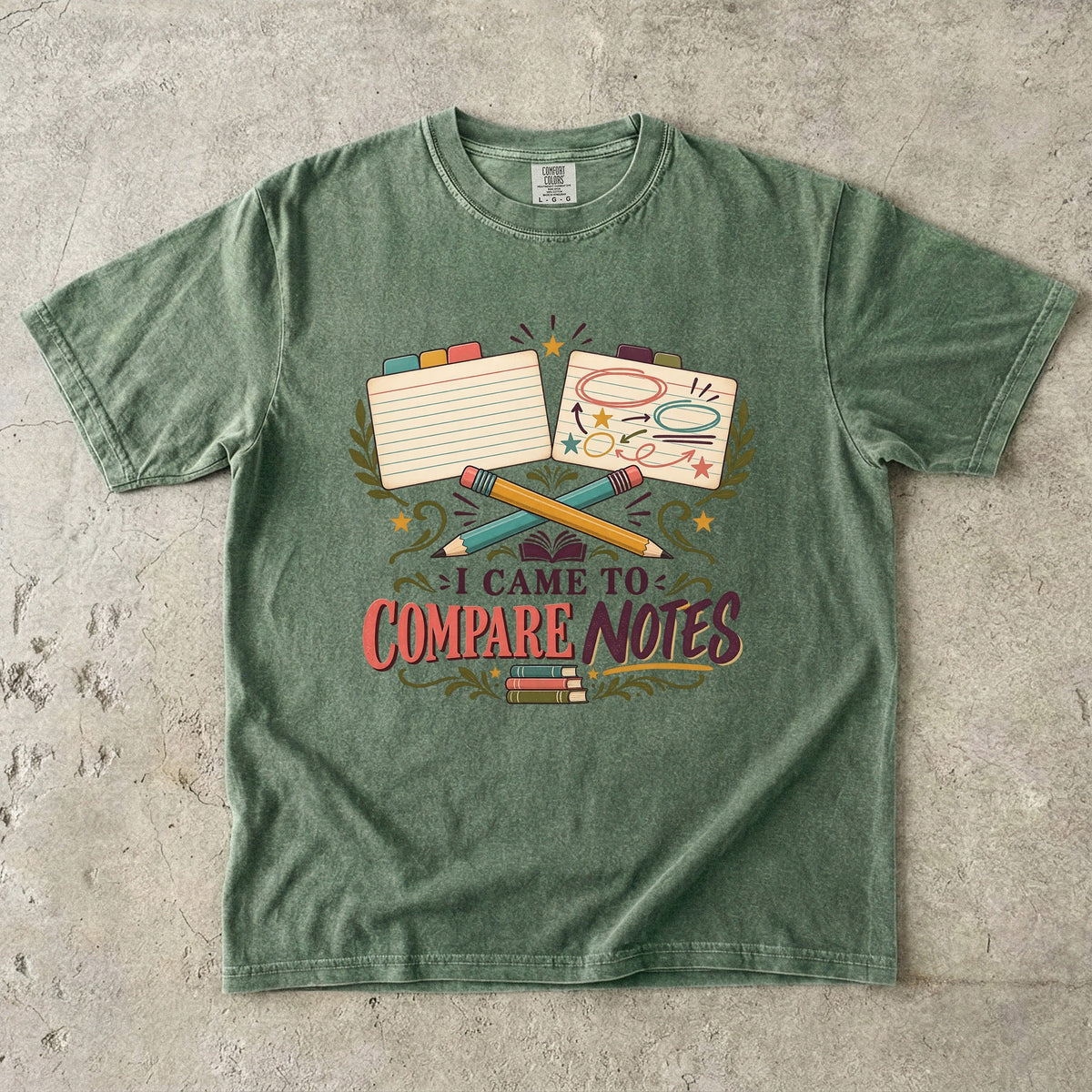 Moss book club T-shirt with “I Came to Compare Notes,” tabbed note cards and crossed pencils