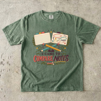 Moss book club T-shirt with “I Came to Compare Notes,” tabbed note cards and crossed pencils