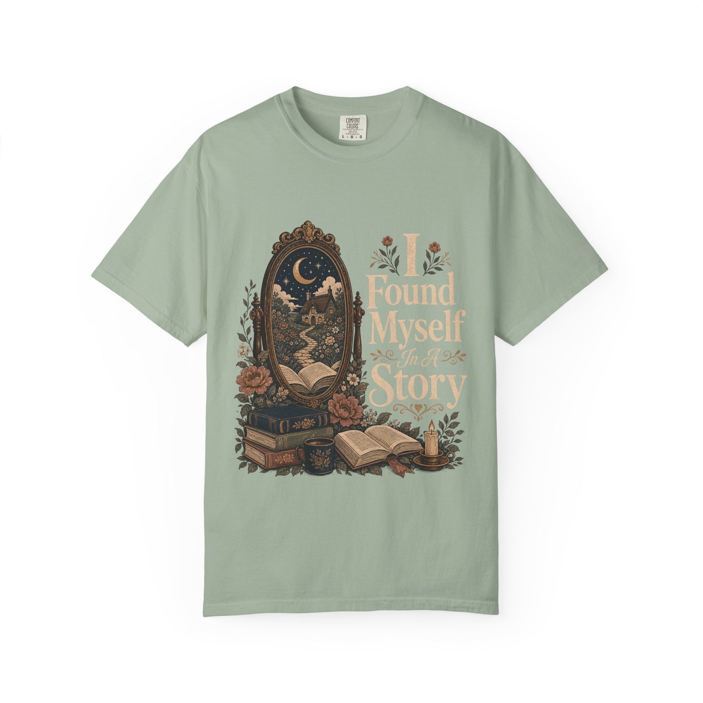 Front view of the I Found Myself In A Story Book Lover Shirt on a Comfort Colors 1717 garment-dyed T-shirt in Bay featuring an antique mirror, books and cottagecore-inspired literary artwork.