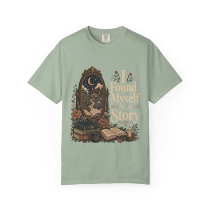 Front view of the I Found Myself In A Story Book Lover Shirt on a Comfort Colors 1717 garment-dyed T-shirt in Bay featuring an antique mirror, books and cottagecore-inspired literary artwork.