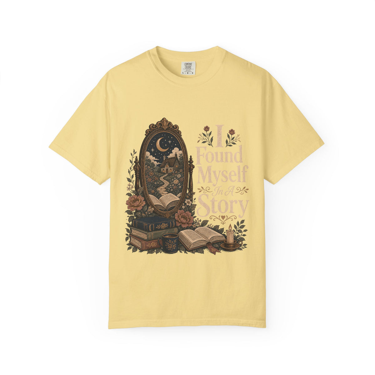 I Found Myself in a Story book lover T-shirt in Butter featuring a moonlit cottage, ornate mirror, open books and flowers