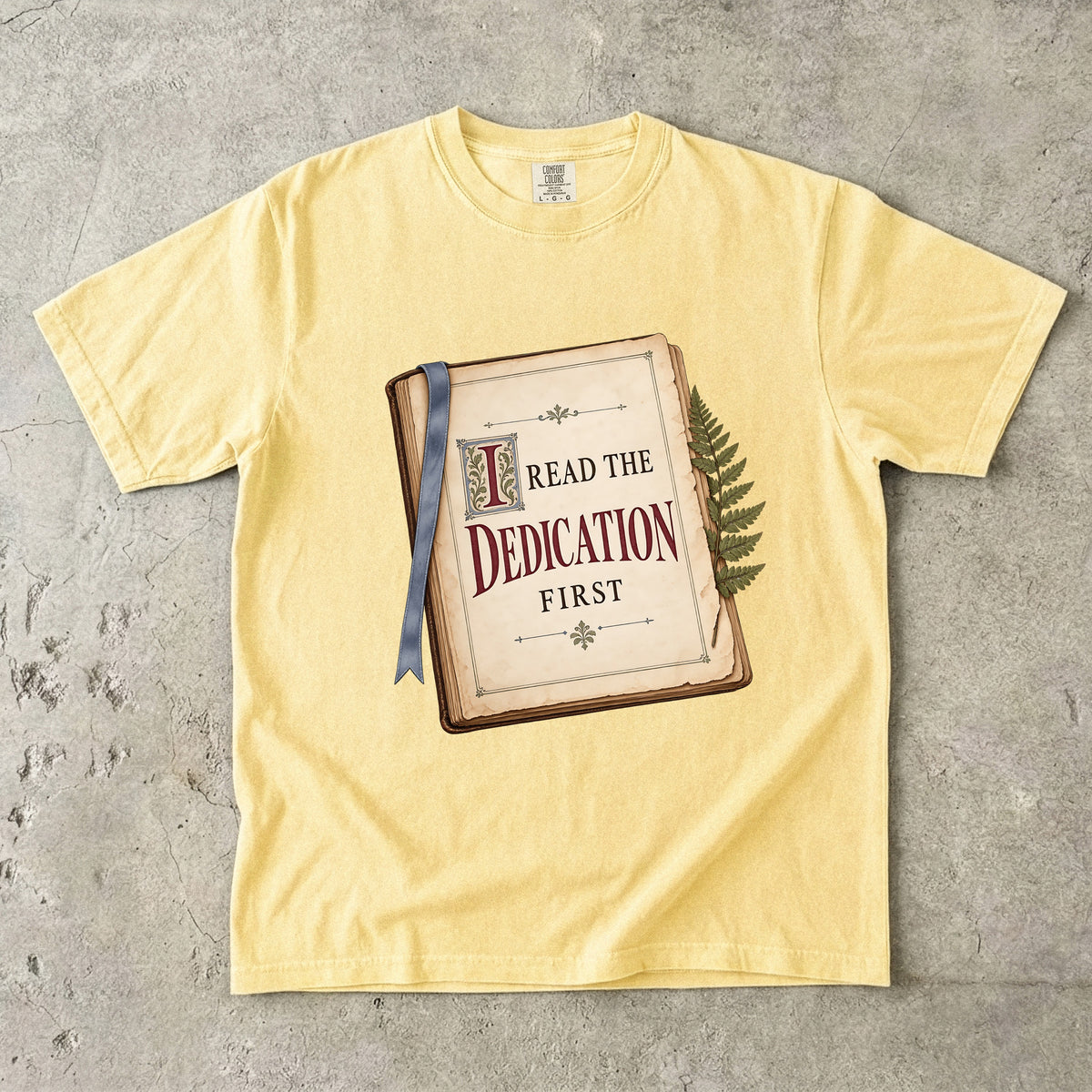 Butter reader T-shirt with “I Read the Dedication First” inside an illustrated old book