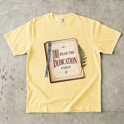Butter reader T-shirt with “I Read the Dedication First” inside an illustrated old book