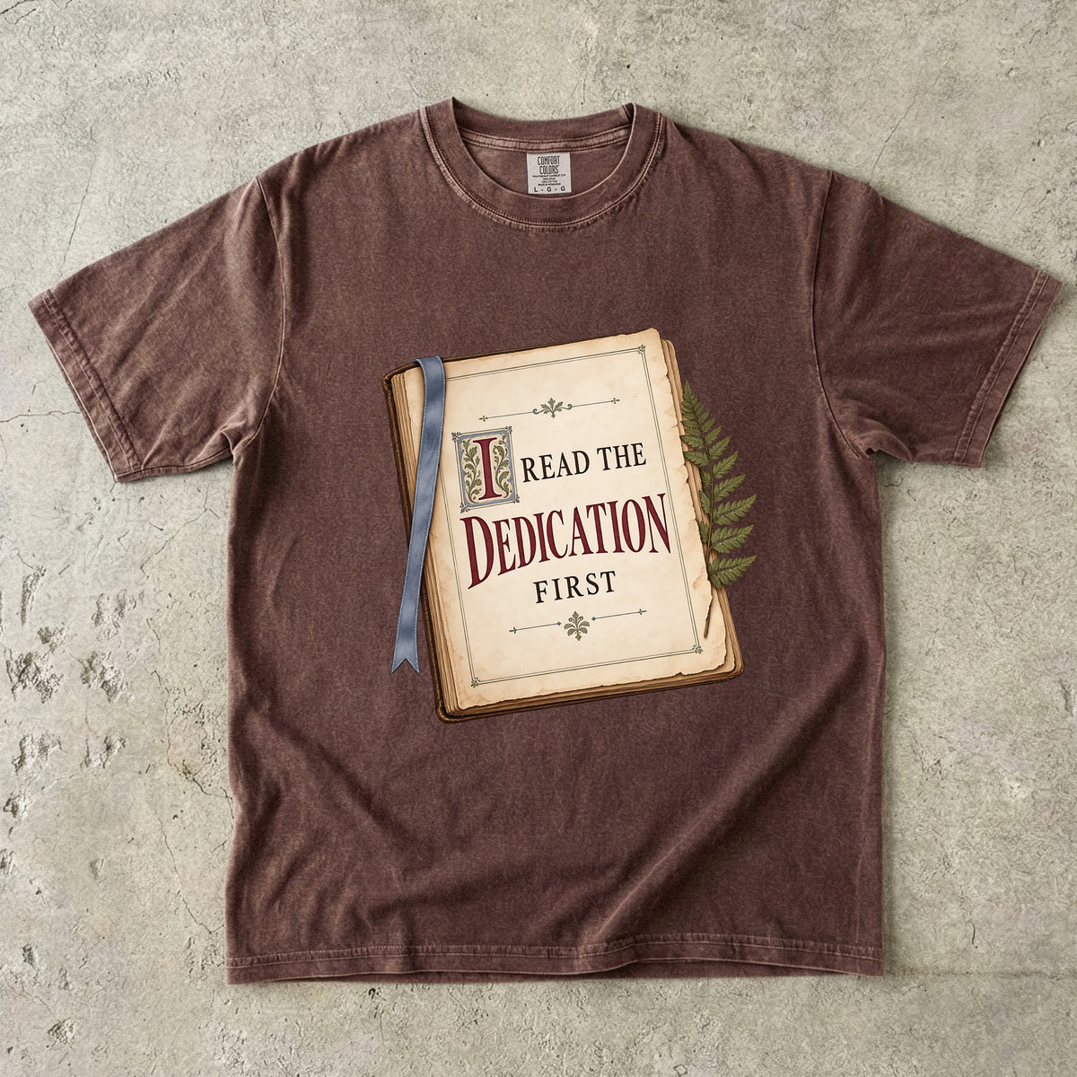 Espresso reader T-shirt with “I Read the Dedication First” inside an illustrated old book