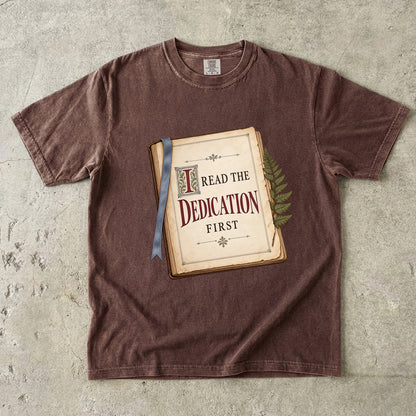 Espresso reader T-shirt with “I Read the Dedication First” inside an illustrated old book