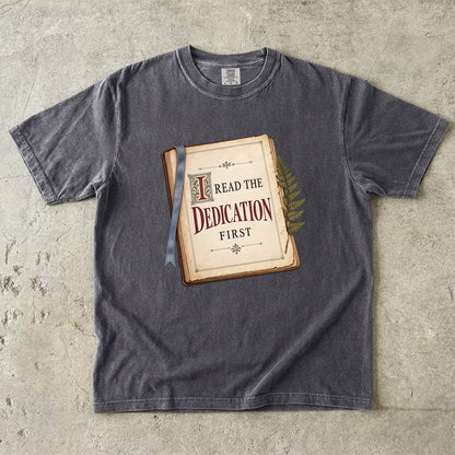 Pepper reader T-shirt with “I Read the Dedication First” inside an illustrated old book