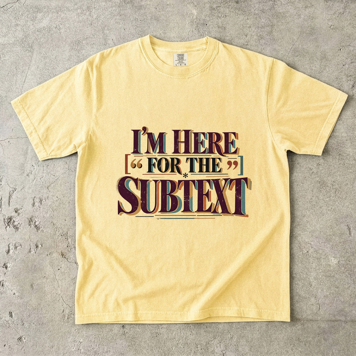 Butter literary T-shirt with “I’m Here for the Subtext” in bold layered vintage lettering