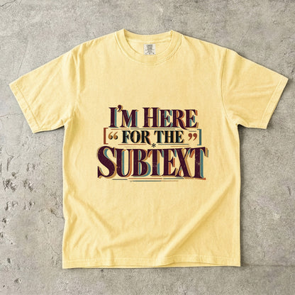 Butter literary T-shirt with “I’m Here for the Subtext” in bold layered vintage lettering
