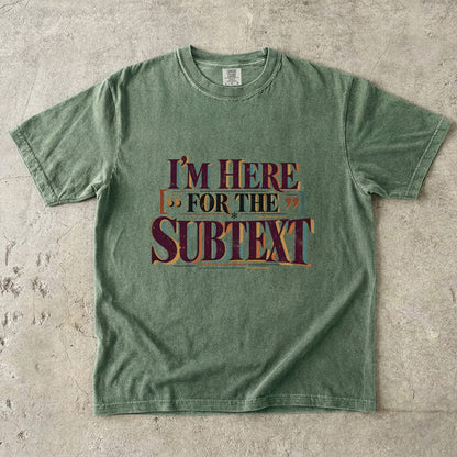 Moss literary T-shirt with “I’m Here for the Subtext” in bold layered vintage lettering