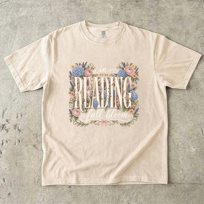 Ivory Comfort Colors bookish T-shirt featuring the In Reading, Full Bloom botanical reader design with vintage floral details.