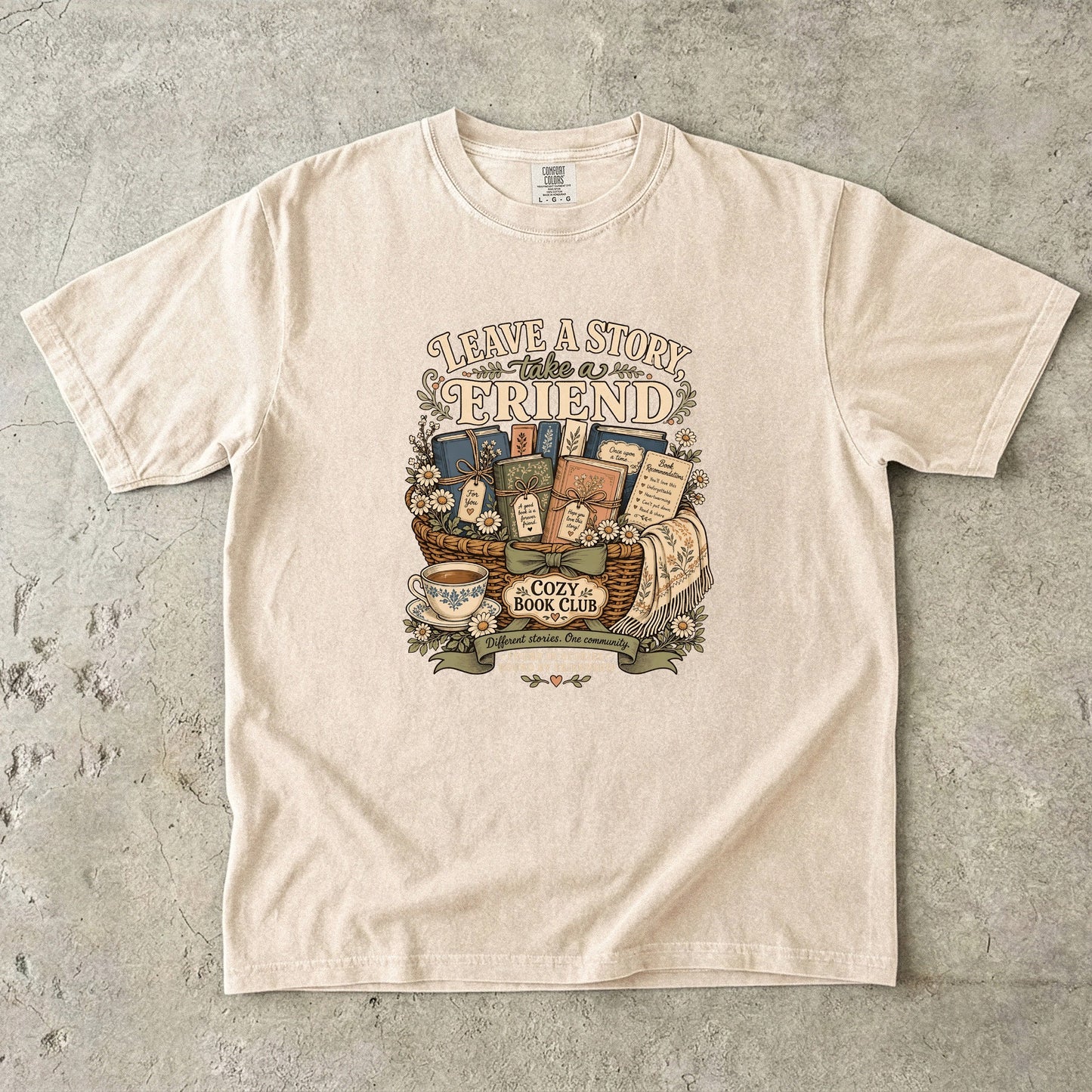 Leave a Story, Take a Friend book club T-shirt with gift basket of books and flowers on Ivory.