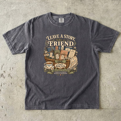 Leave a Story, Take a Friend book club T-shirt with gift basket of books and flowers on Pepper.