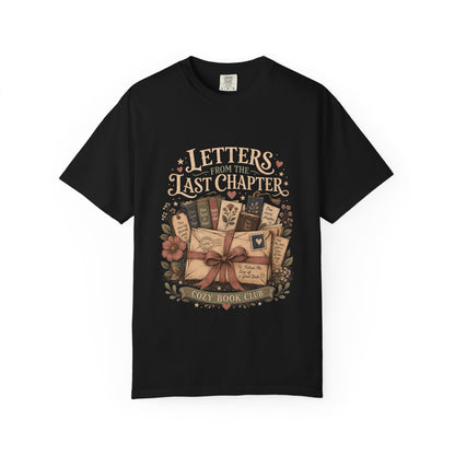 Front view of the Letters From the Last Chapter book club illustration printed on a Black Comfort Colors T-shirt. 
