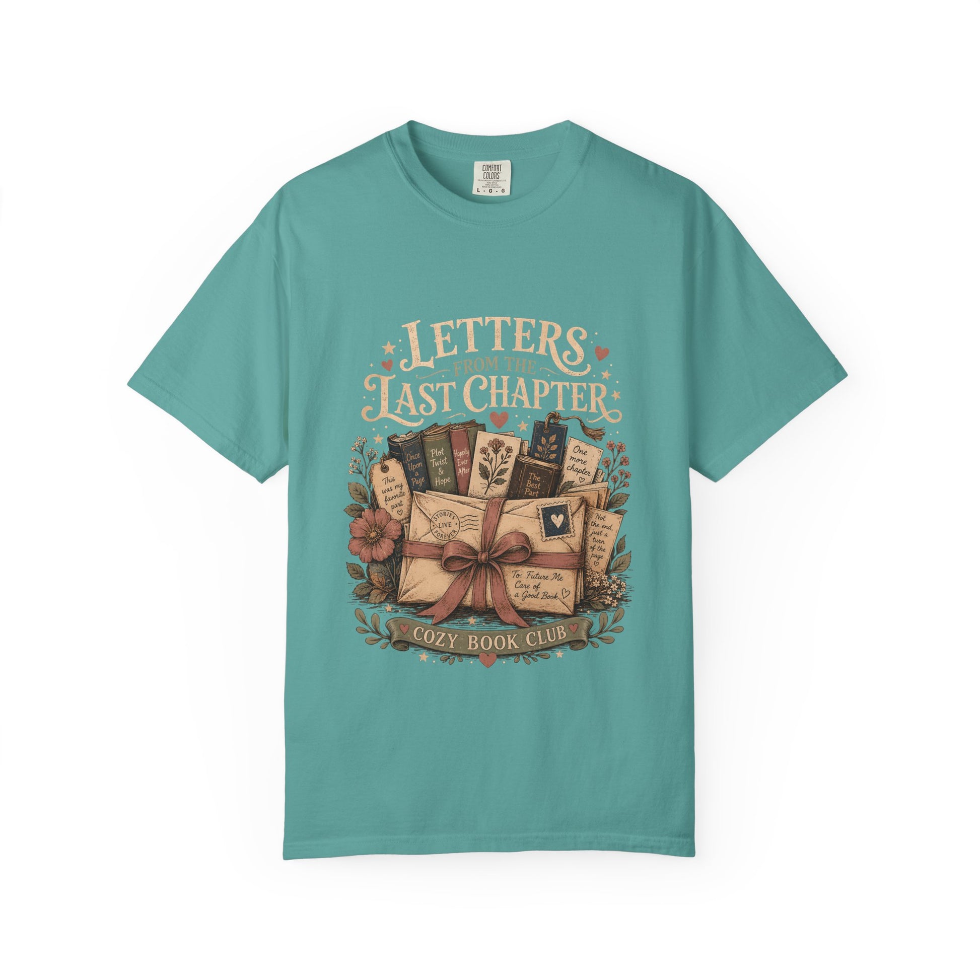 Front view of the Letters From the Last Chapter book club illustration printed on a Seafoam Comfort Colors T-shirt. 