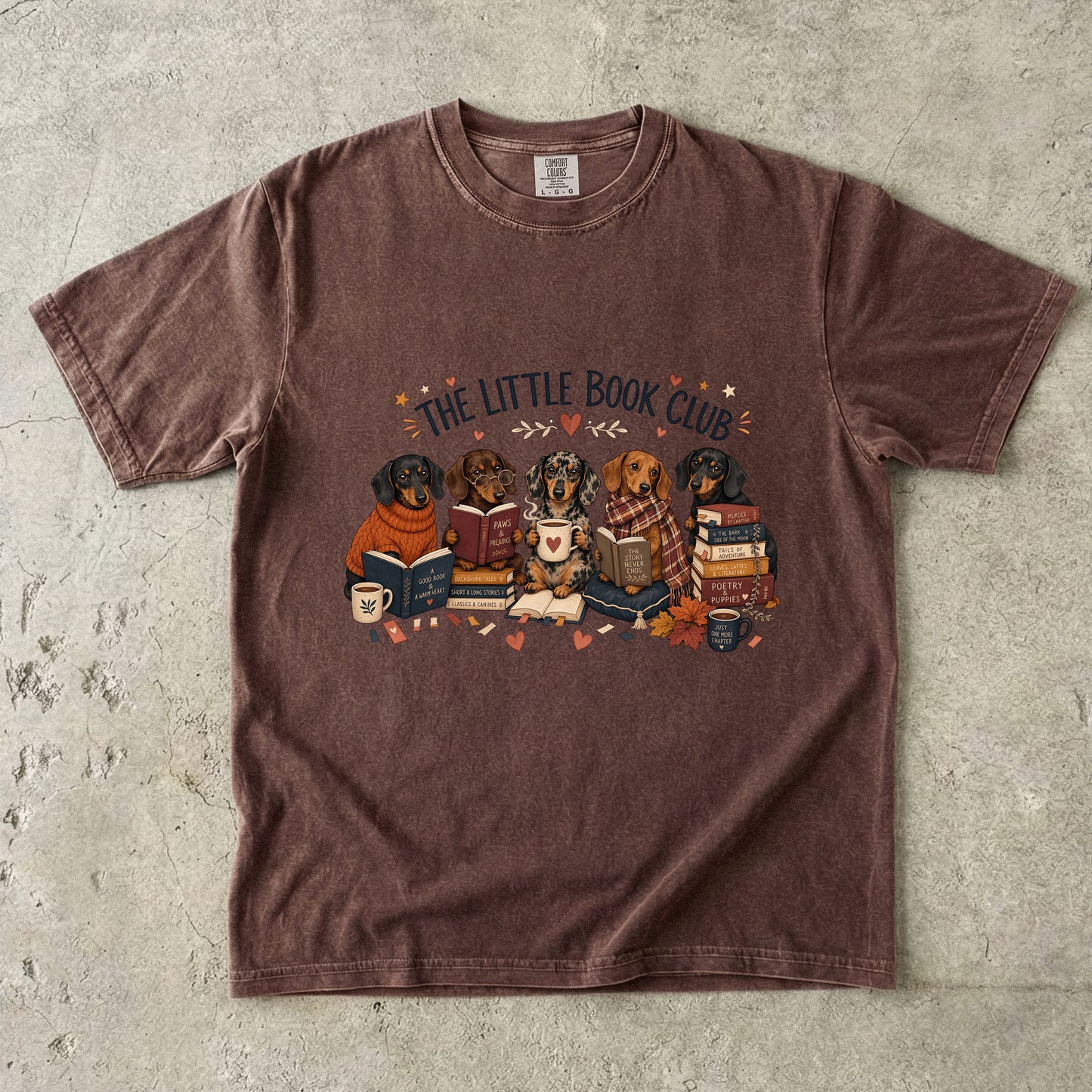 Espresso Comfort Colors book club T-shirt featuring a group of dachshunds surrounded by books and cozy reading details.