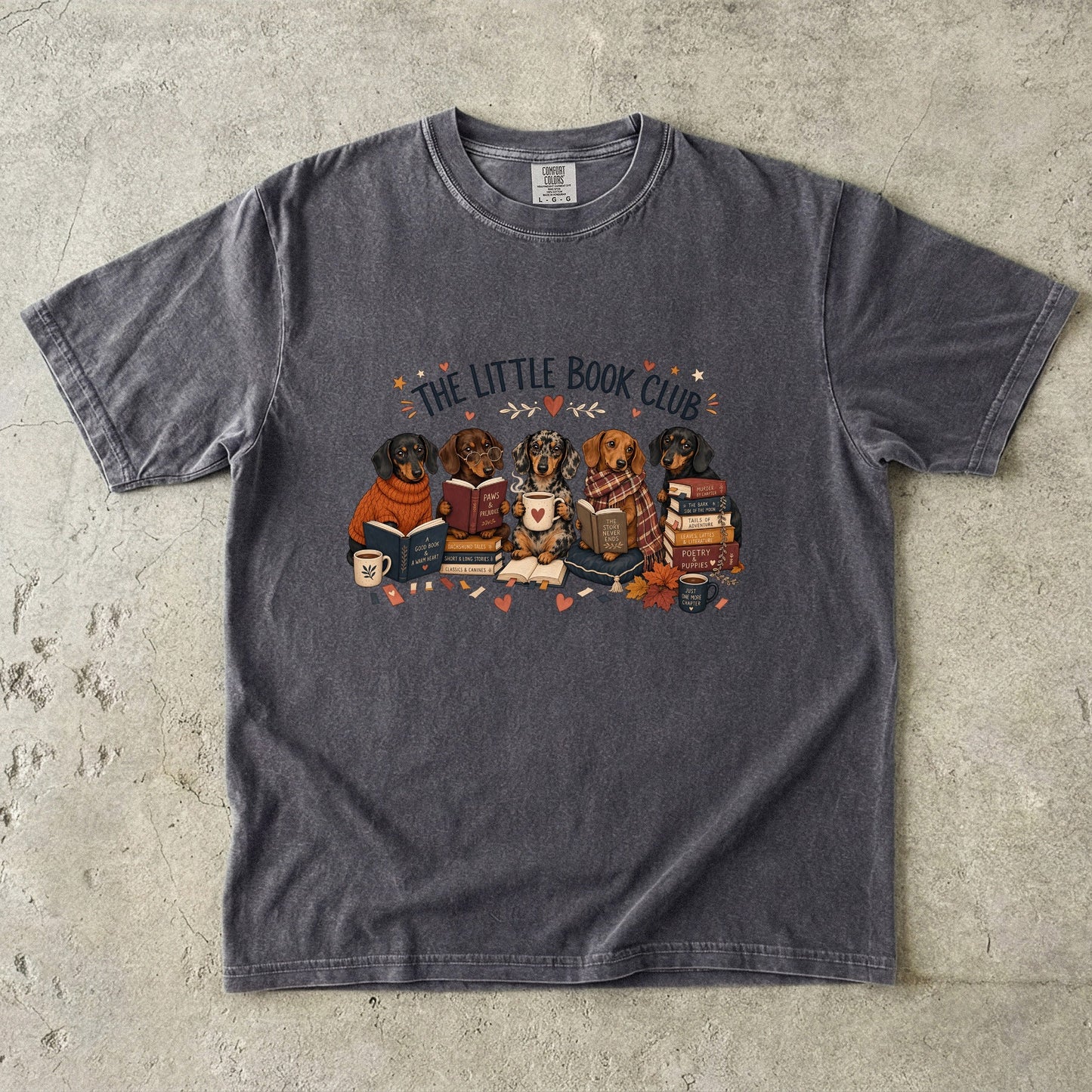 Pepper Comfort Colors book lover T-shirt featuring The Little Book Club dachshund reading illustration.