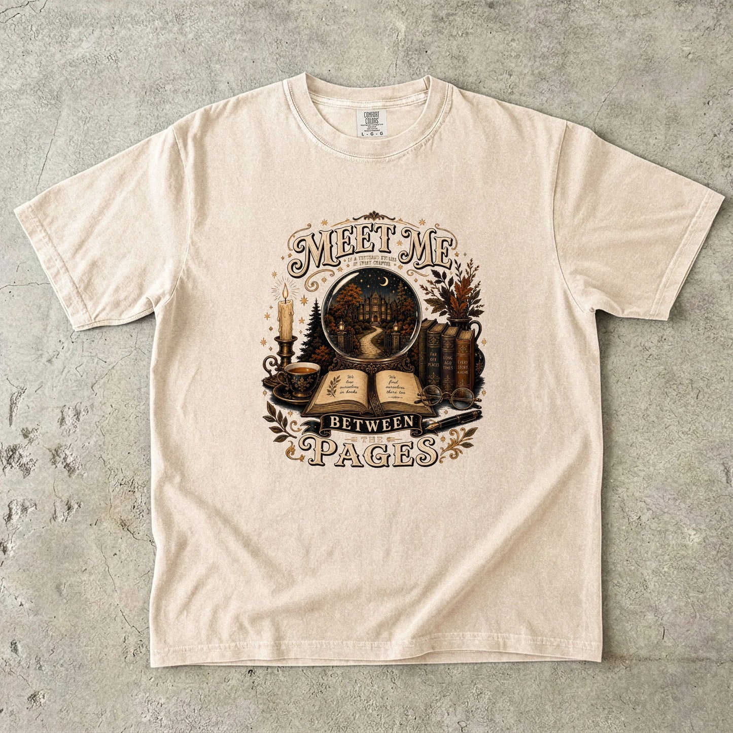 Ivory Comfort Colors book lover T-shirt with the Meet Me Between the Pages vintage literary illustration.
