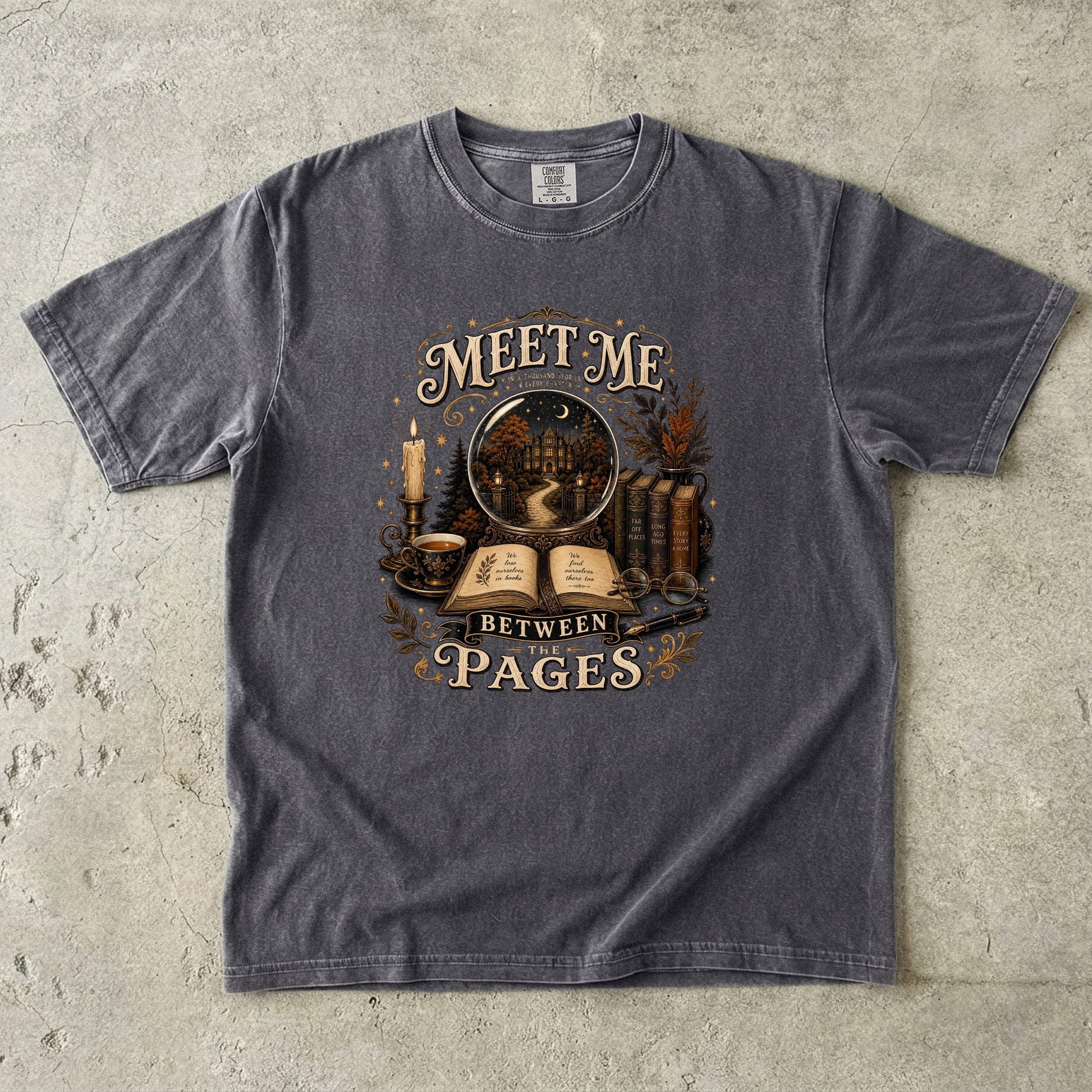 Pepper Comfort Colors book lover T-shirt featuring the Meet Me Between the Pages vintage reading design.