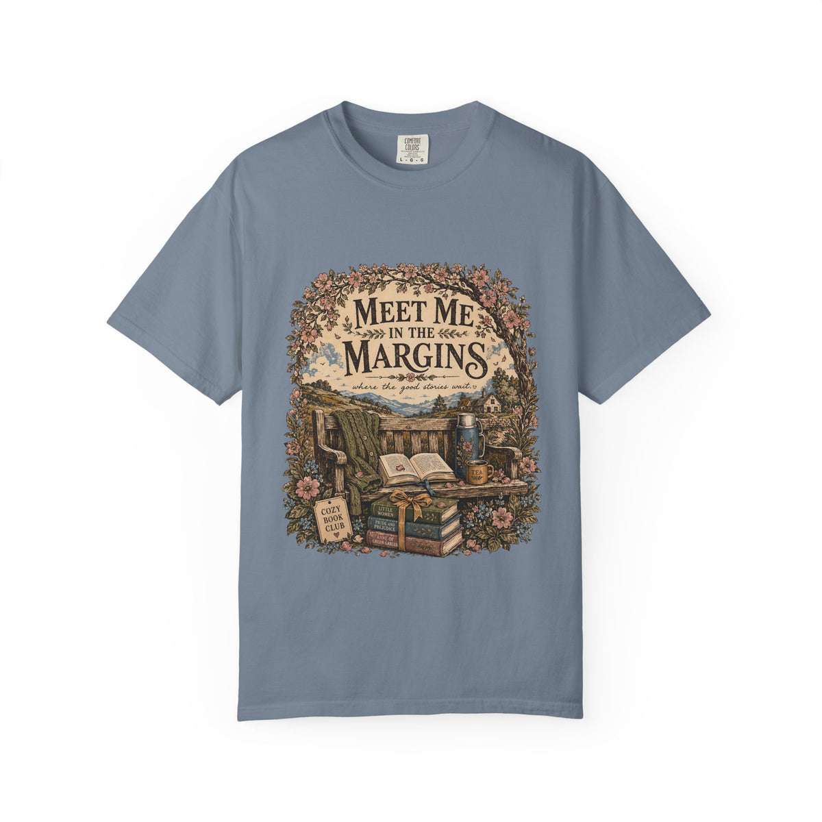 Meet Me in the Margins reading T-shirt featuring books, tea and a flower-framed countryside reading bench on Blue Jean.