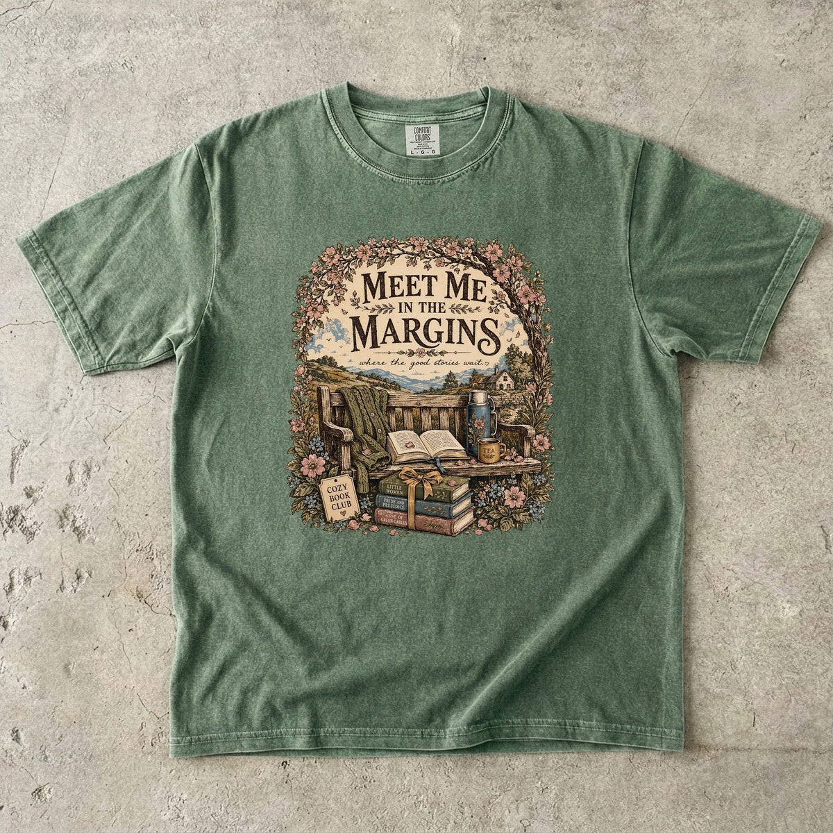Meet Me in the Margins reading T-shirt featuring books, tea and a flower-framed countryside reading bench on Moss.