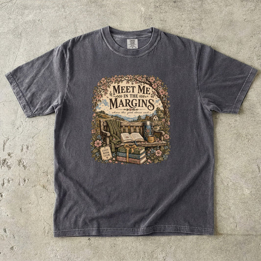 Meet Me in the Margins reading T-shirt featuring books, tea and a flower-framed countryside reading bench on Pepper.