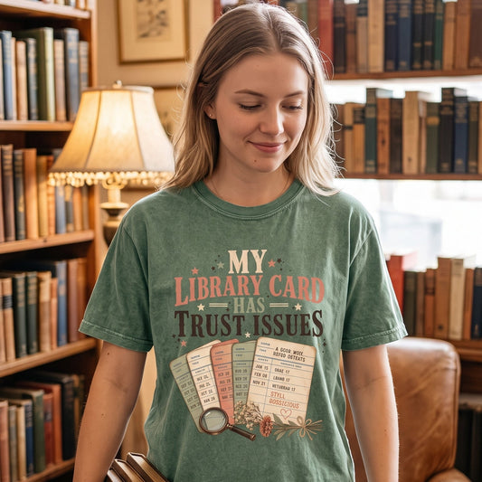 My Library Card Has Trust Issues library lover T-shirt with vintage checkout cards, flowers and magnifying glass artwork.