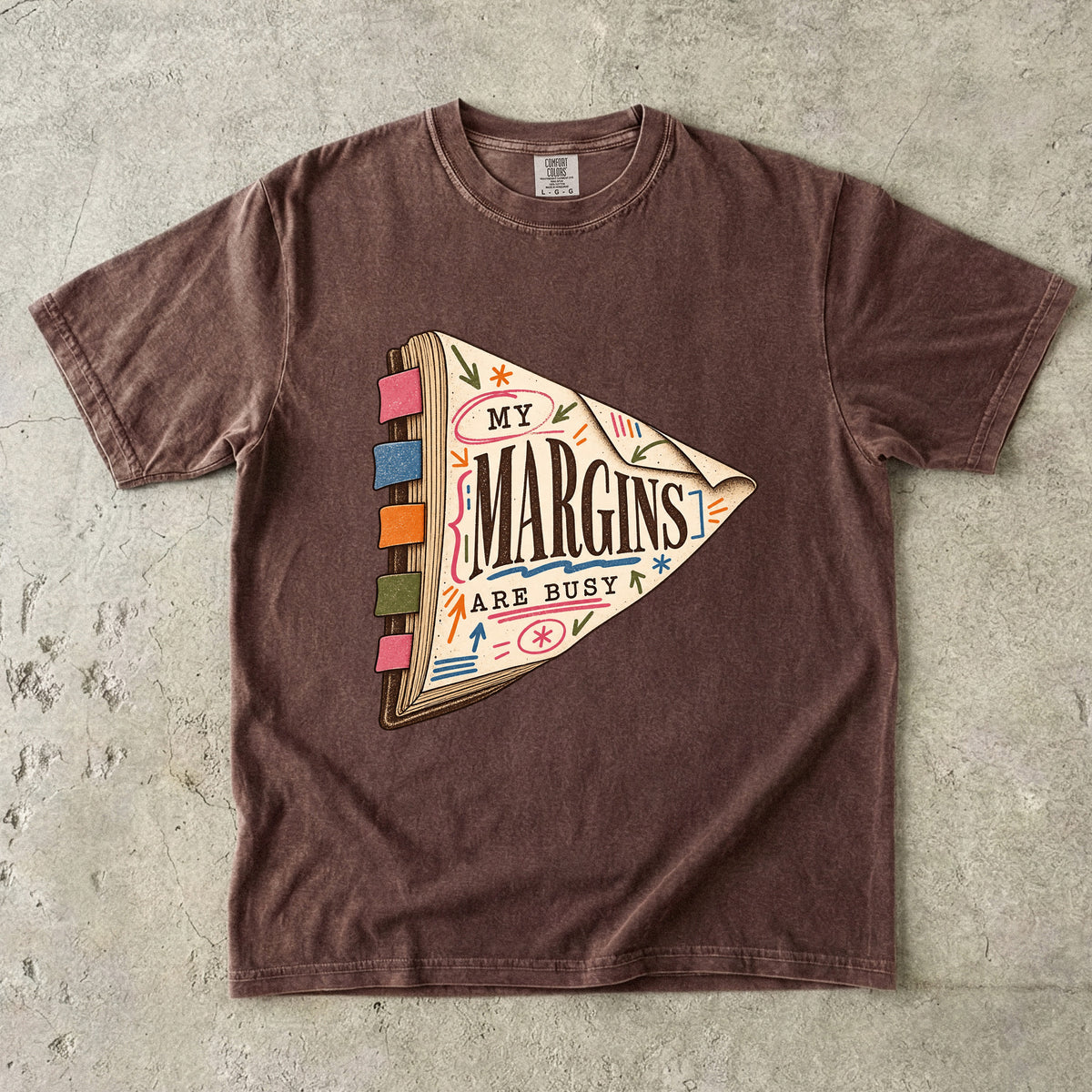 Espresso reading T-shirt with “My Margins Are Busy” on a tabbed book with colourful annotations