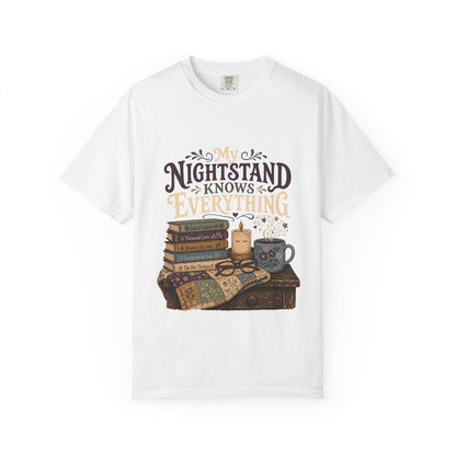 White Book Lover T-Shirt featuring the My Nightstand Knows Everything design with stacked books, candle, mug and quilt on a bedside table.