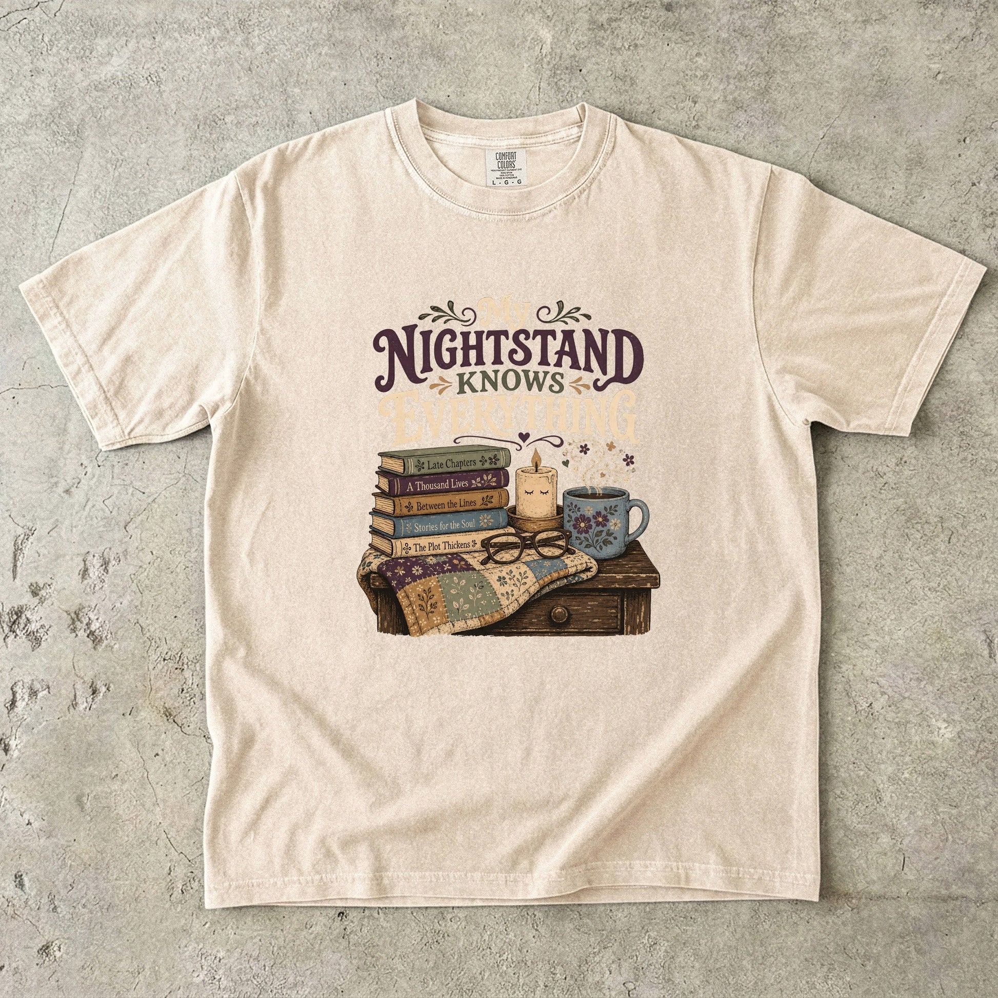 My Nightstand Knows Everything reading T-shirt in Ivory with stacked books, reading glasses, a candle and floral mug