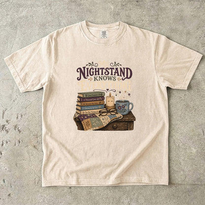My Nightstand Knows Everything reading T-shirt in Ivory with stacked books, reading glasses, a candle and floral mug