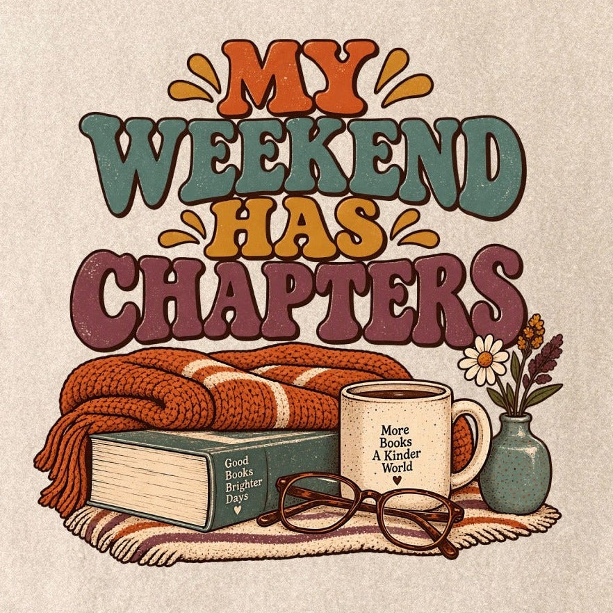 Close-up of the “My Weekend Has Chapters” T-shirt design, showing multicolored vintage lettering, a knitted blanket, book, mug, glasses and a small flower vase.