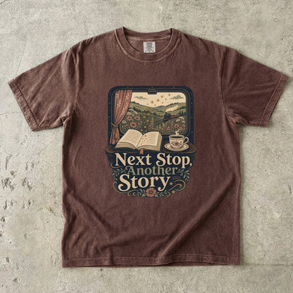Next Stop, Another Story reading T-shirt in Espresso featuring a countryside steam train, open book and floral teacup