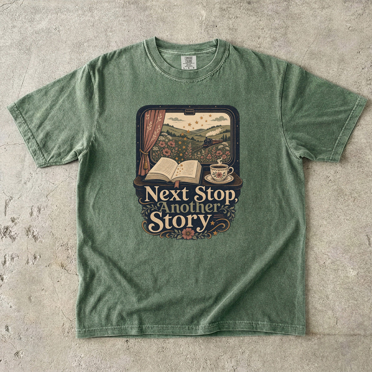 Next Stop, Another Story reading T-shirt in Moss featuring a countryside steam train, open book and floral teacup