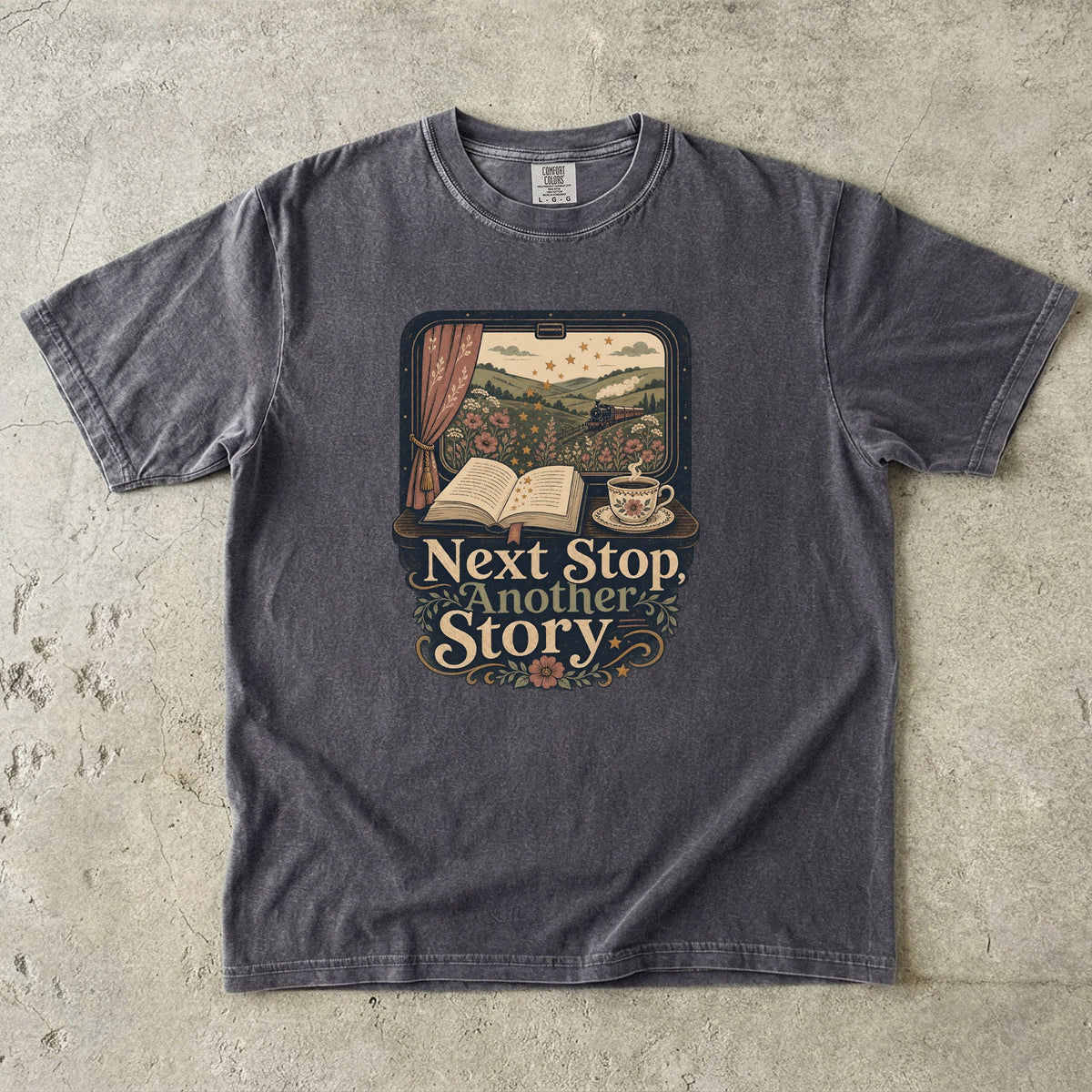 Next Stop, Another Story reading T-shirt in Pepper featuring a countryside steam train, open book and floral teacup
