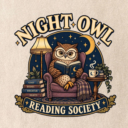 Close-up of the “Night Owl Reading Society” T-shirt design, showing a spectacled owl reading in an armchair, a lamp, books, mug, crescent moon and stars.