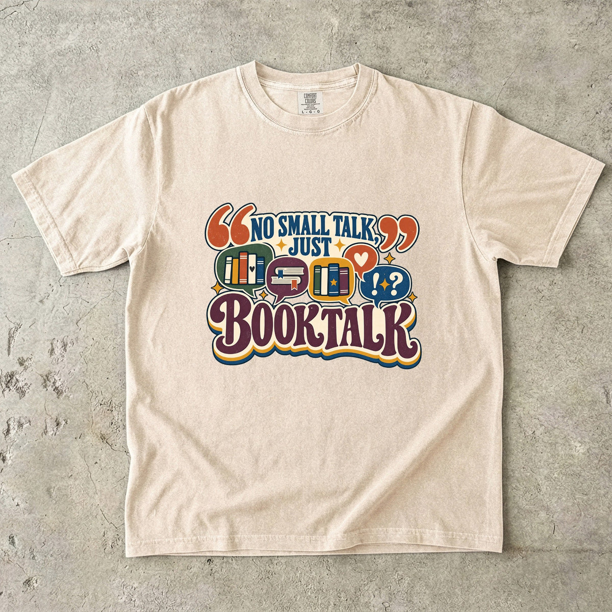 Ivory book lover T-shirt with “No Small Talk, Just Book Talk” and colourful book conversation bubbles