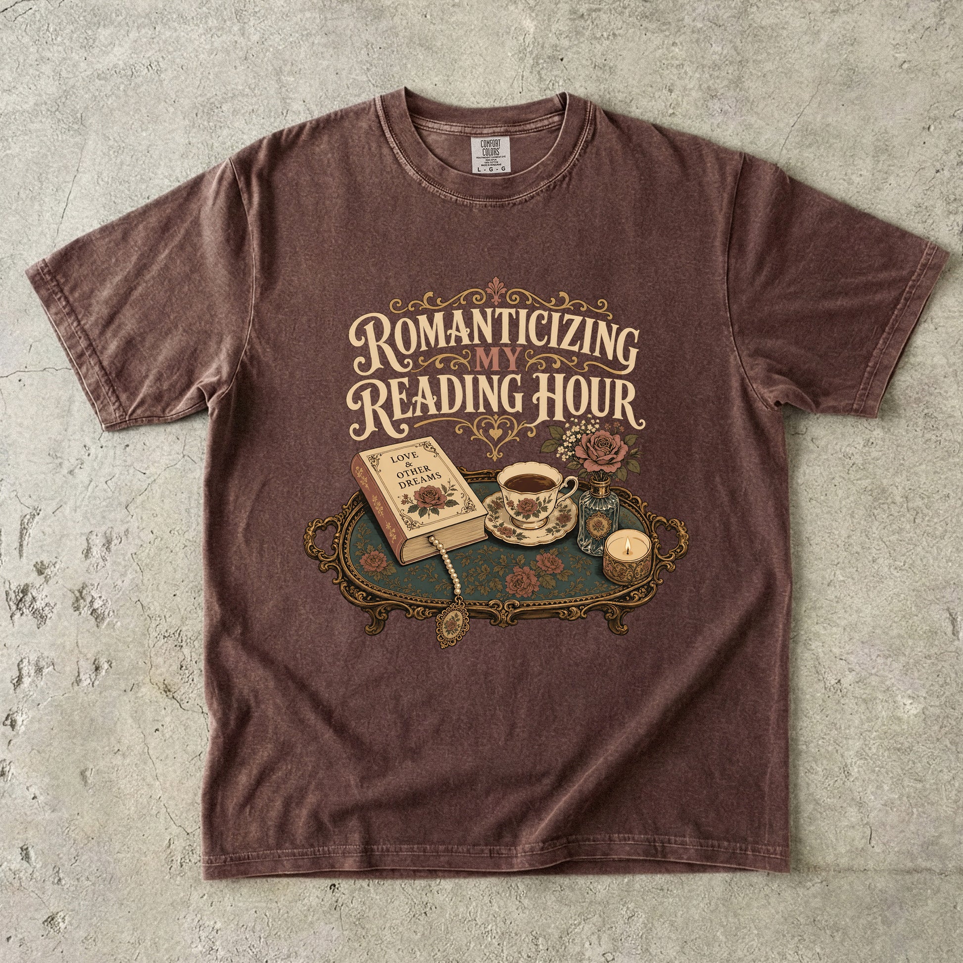 Front view of an Espresso Comfort Colors® book lover T-shirt featuring the Romanticizing My Reading Hour vintage literary design with books, tea, candlelight and romantic floral details.