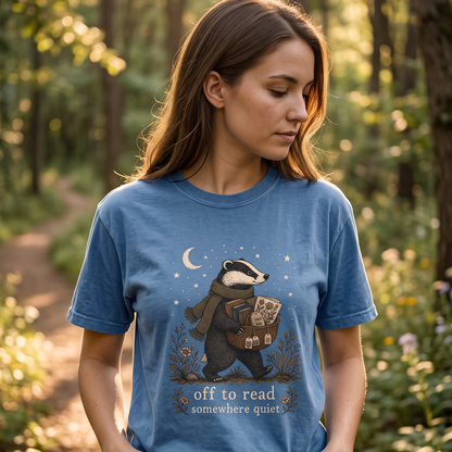 Off to Read Somewhere Quiet reading T-shirt featuring a woodland badger with books, tea, flowers, moon and stars