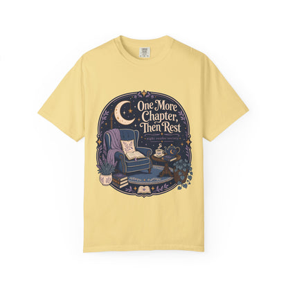 One More Chapter Then Rest night reader T-shirt with cozy armchair, open book, moon, teapot and botanical details on Butter.